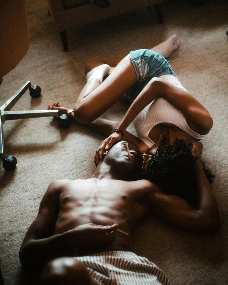 A couple relaxing indoors in an intimate and calm setting in Abuja, Nigeria.